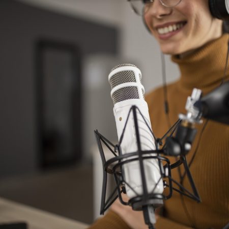 woman-broadcasting-radio-while-smiling